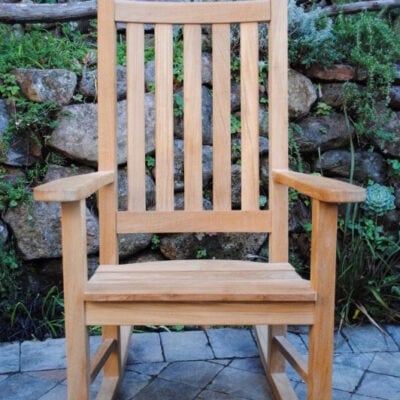 close up view of teak Calistoga Rocking Chair sitting on a patio Paradise Teak Bay Area California