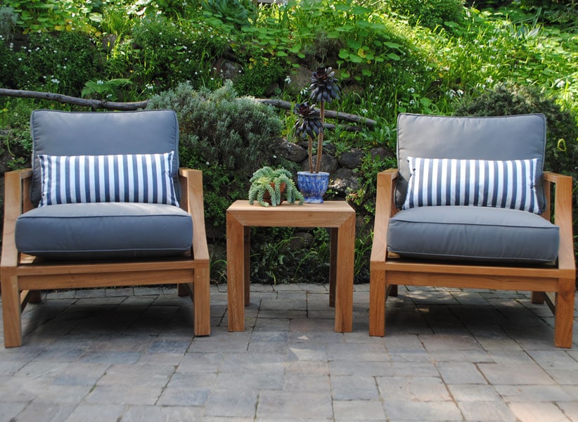 2 Deep Seating Chairs with blue cushions and accent pillows with Side Table in between Paradise Teak Bay Area California