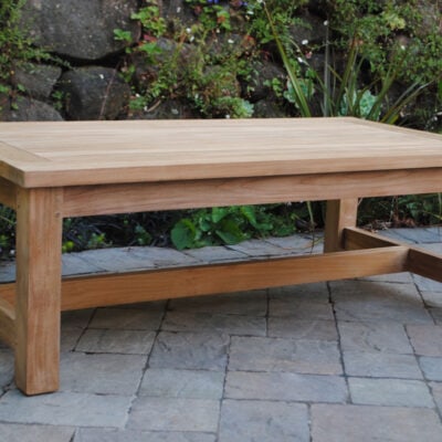 Large Rectangle teak Coffee Table on a patio with rocks and greenery in background Paradise Teak Bay Area California